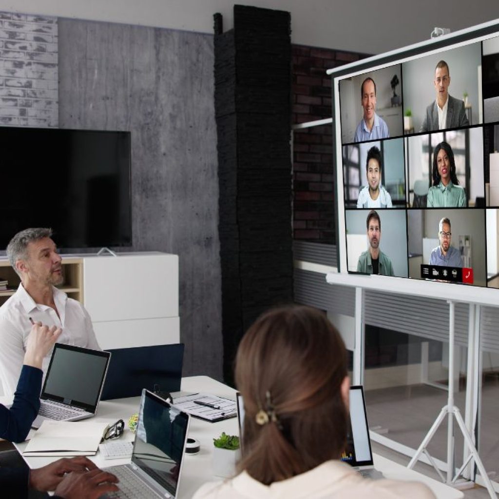 An image of employees conducting a business video conference. 